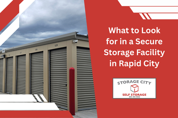 Storage facility with outdoor lighting and a visible surveillance camera with the headline What to look for in a secure storage facility in Rapid City