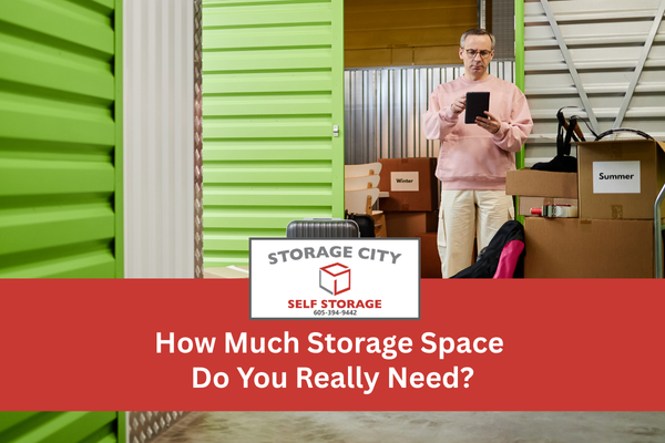 Man with boxes next to a storage unit - Choosing the right size storage unit size